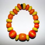 Bracelet Size Medium/Adult Female 3.5 in to 4 in Made with Leather Cord, 12 Wood Beads and 1 Plastic Bead Price: $5.00