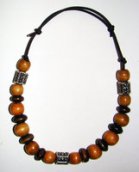 Necklace Size Small/Child 6.5 in to 8.5 in Made with Leather Cord, 20 Wood Beads and 3 Plastic Beads Price: $7.00